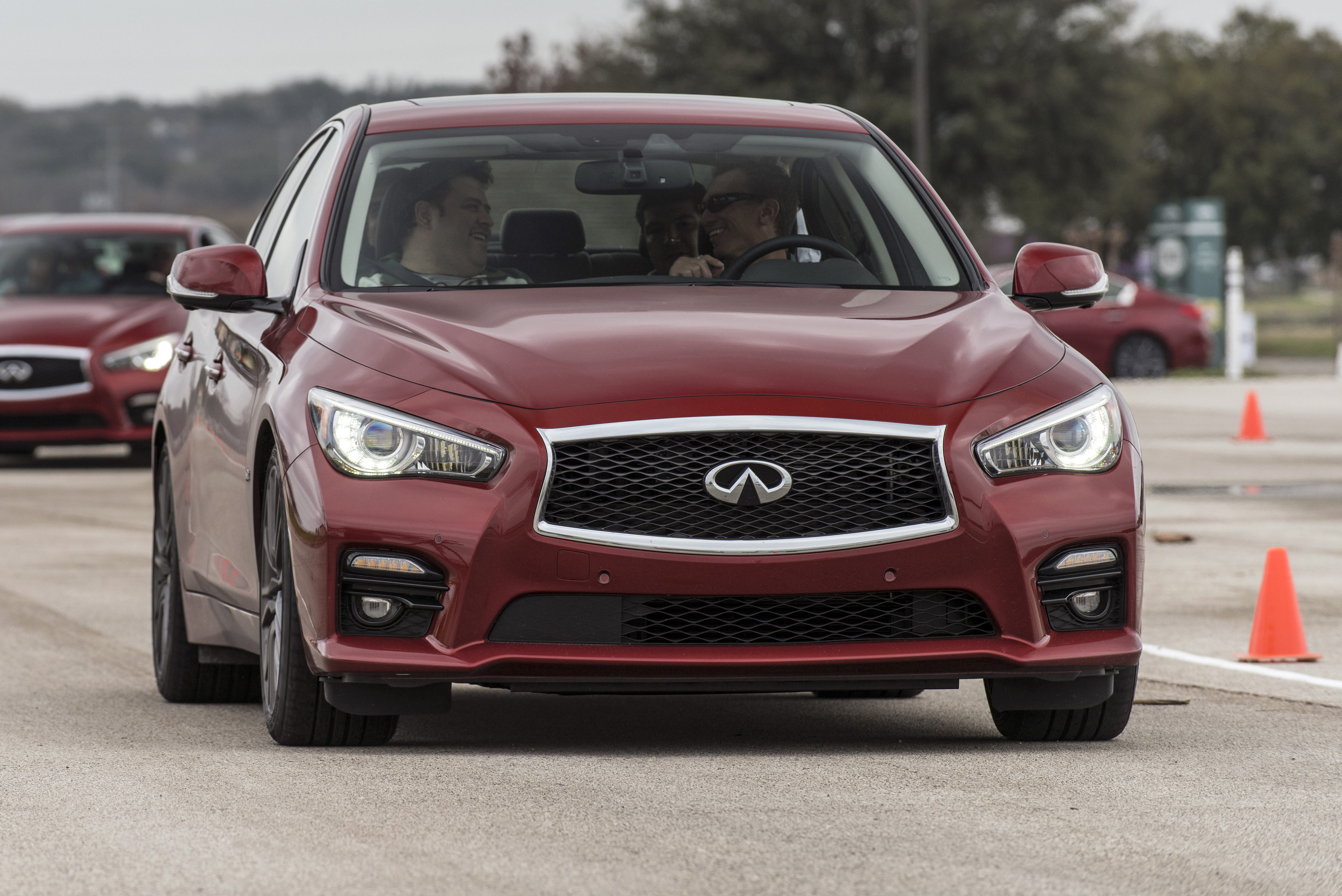 Indications of safety technology on the 2016 Infiniti Q50 can be seen on the rear-view mirror and bumper fascia in this image. (Provided by Infiniti)