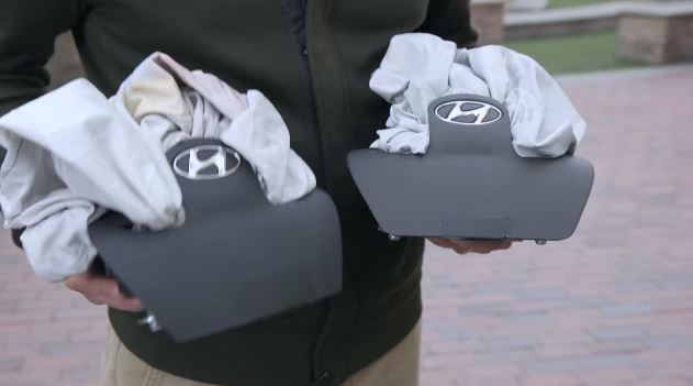 A real and counterfeit Hyundai airbag is shown in this screenshot from Hyundai video. (Screenshot of Hyundai video on YouTube)