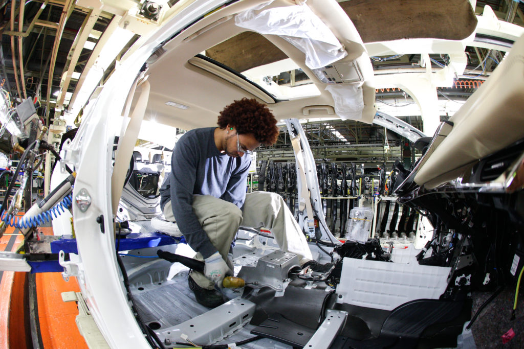 An employee works on a Toyota Avalon at Toyota's Georgetown, Ky., plant.