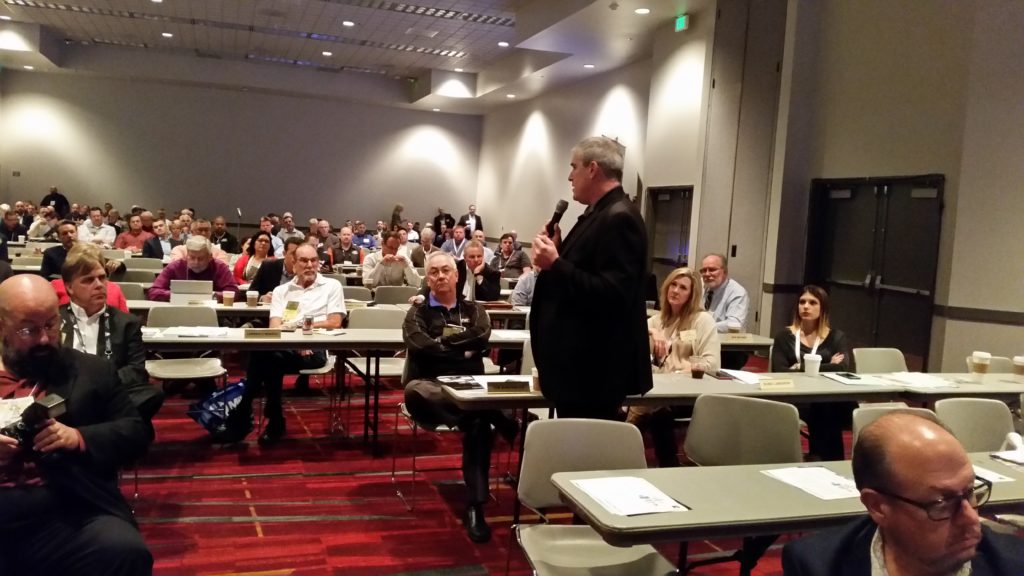 Mark Olson of Vehicle Collision Experts talks during the open mic of the November 2016 Collision Industry Conference. (John Huetter/Repairer Driven News)