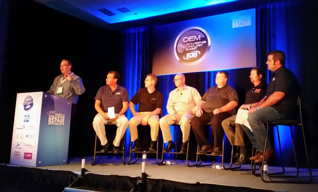 From left, Aaron Schulenburg of SCRS introduces the panel: Gary Wano of G.W. and Sons, Shawn Hart of Audi, Mike Kukavica of Porsche, Rick Miller of Jaguar Land Rover, James Meyer of Toyota and Barry Dorn of Dorn's Body and Paint, during the an OEM trainer forum on Nov. 3, 2016, at SEMA. (John Huetter/Repairer Driven News)