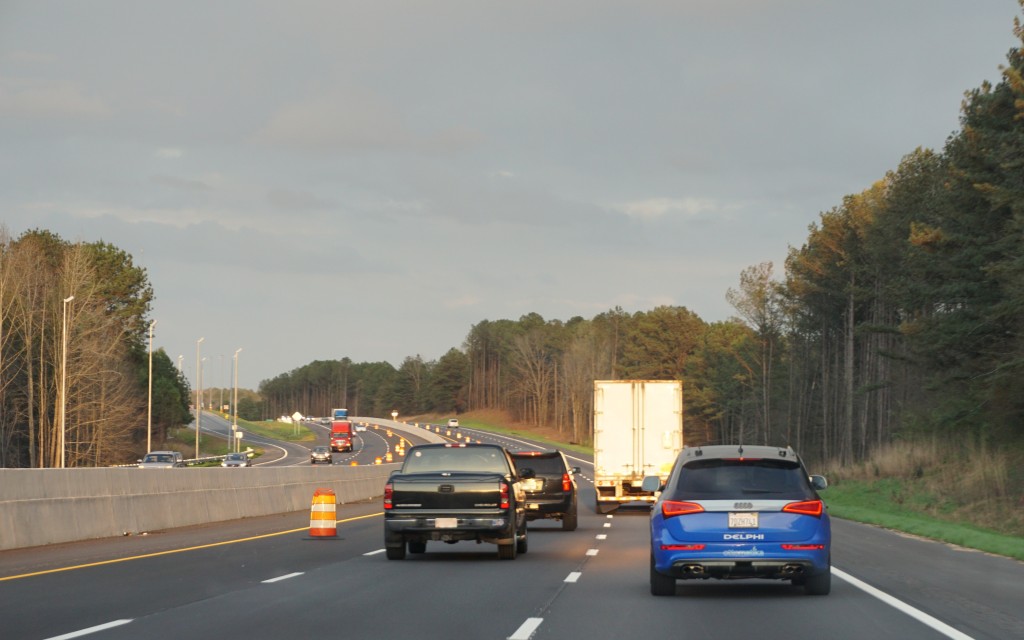 A Delphi self-driving Audi, right, is tested on a highway. (Provided by Delphi)