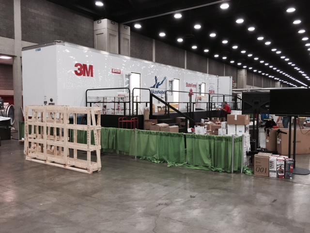 A modified trailer contains separate paint stations for the automotive refinish competition at the SkillsUSA Championships in Louisville, Ky., in June 2015. (Kye Yeung/Society of Collision Repair Specialists) The modified tractor trailer with separate spray stations inside 