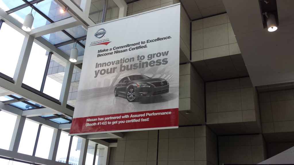 A banner touts Nissan certification in the Cobo Center during NACE 2015. (John Huetter/Repairer Driven News)