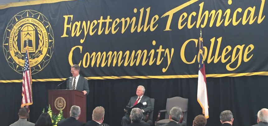 I-CAR CEO John Van Alstyne, left, speaks at the February 2015 grand opening of the Fayetteville Technical Community College collision repair program. FTCC President Larry Keen is at right. (Provided by I-CAR)